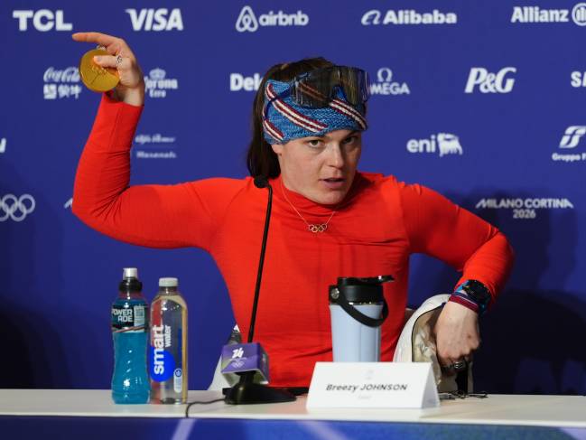 Gold medallist USA's Breezy Johnson shows her broken medal to the media following the Women's Alpine Downhill Skiing at the Tofane Alpine Skiing Centre, Cortina d'Ampezzo, on day two of the Milano Cortina 2026 Winter Olympics. Picture date: Sunday February 8, 2026. (Photo by Andrew Milligan/PA Images via Getty Images)