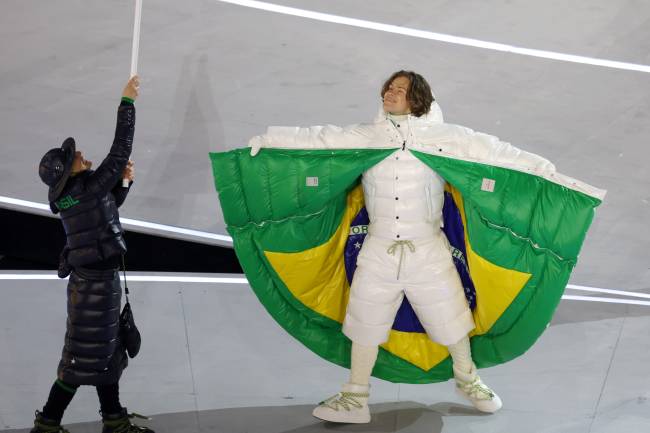 MILAN, ITALY - FEBRUARY 06: Flagbearer Lucas Pinheiro Braathen of Team Brazil enters into the stadium during the opening ceremony of the Milano Cortina 2026 Winter Olympics at San Siro Stadium on February 06, 2026 in Milan, Italy. (Photo by Alexander Hassenstein/Getty Images)